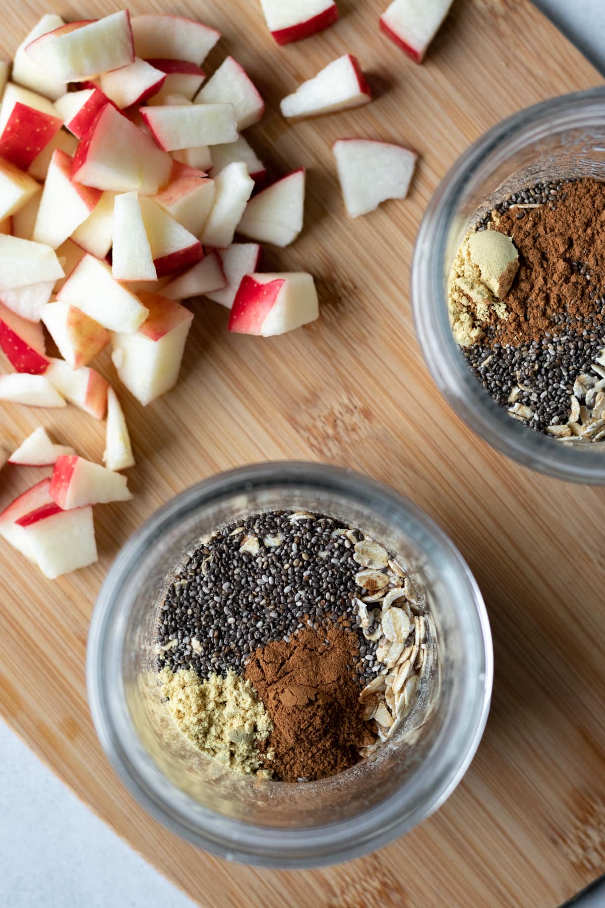 adding ingredients to small pint jars.