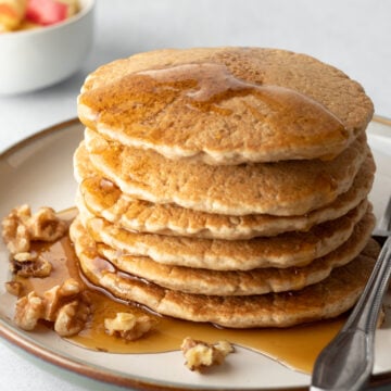 stack of vegan pancakes with maple syrup