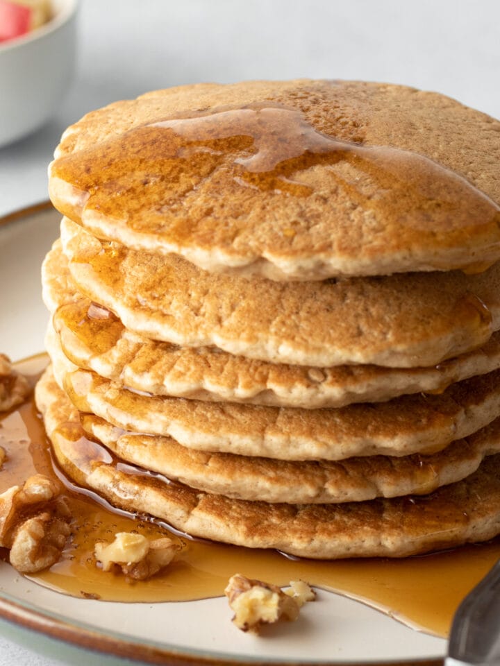 stack of vegan pancakes with maple syrup