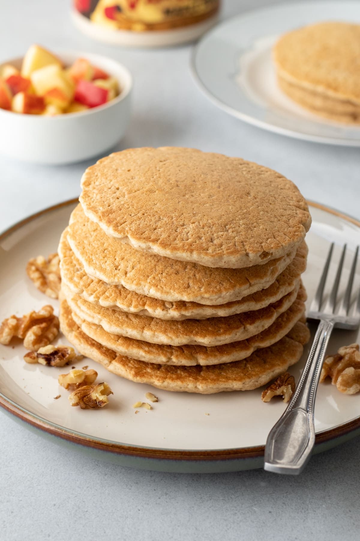 a stack of golden vegan pancakes made with oat flour.