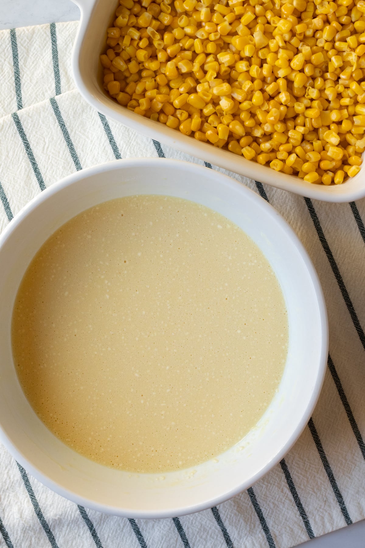add corn to baking dish and whisk other ingredients in a bowl.