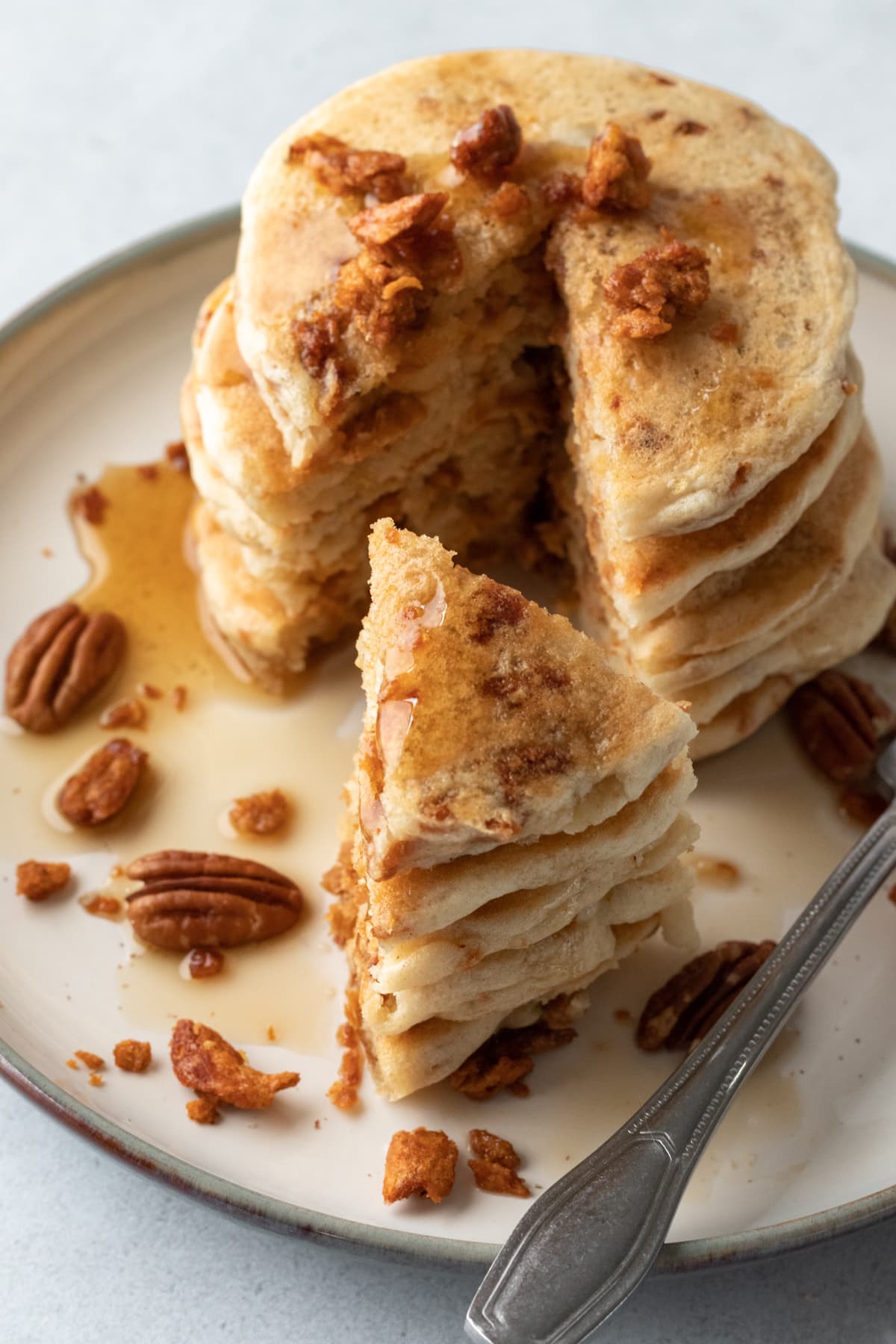 pancake stack drizzled with maple syrup