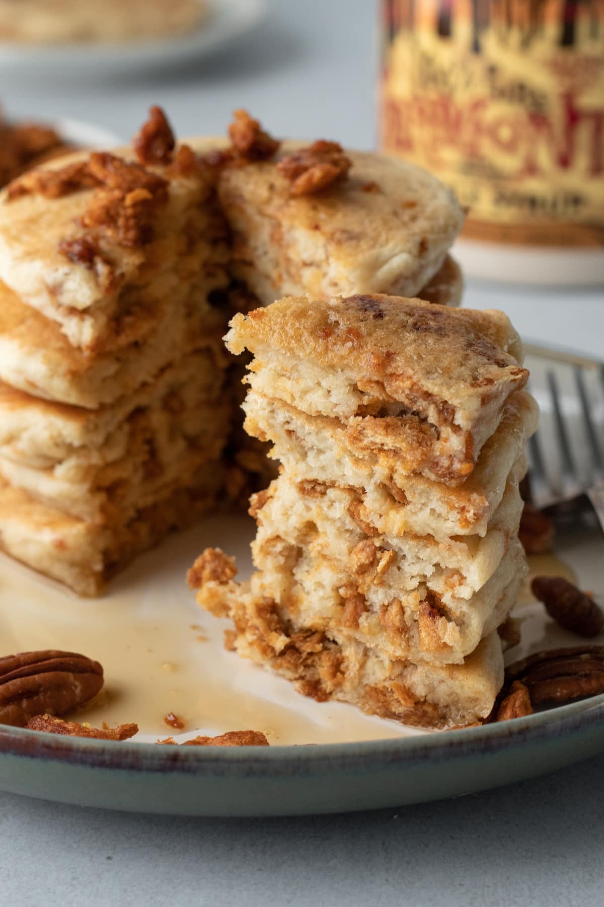 tall stack of pancakes with a wedge cut out showing fluffy texture