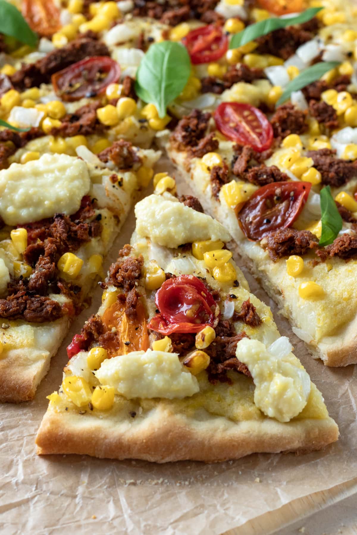 close up of toppings on a slice of pizza