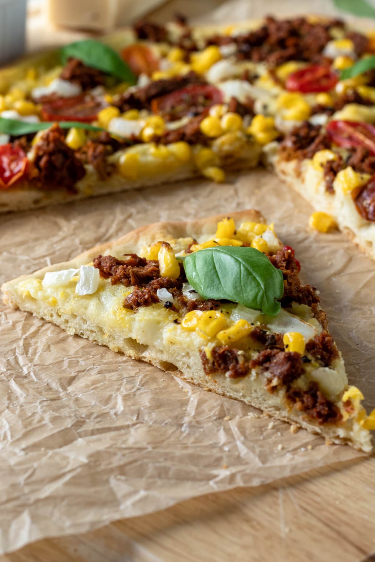 side view showing texture of crisp vegan pizza crust.