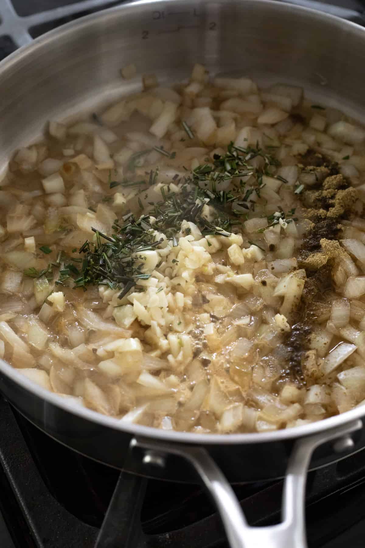 sautéing onion, garlic and herbs to be mixed into the mashed sweet potatoes.