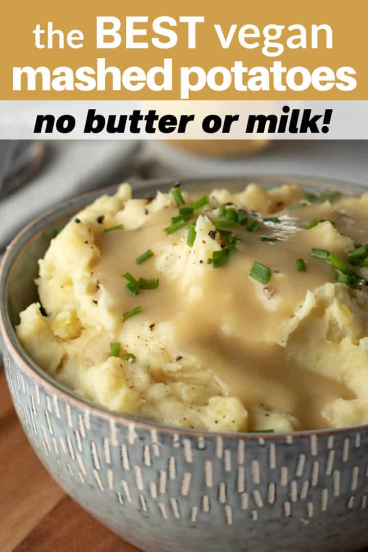 bowl of mashed potatoes with vegan brown gravy and title text overlay to save on Pinterest.