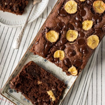 overhead view of chocolate banana bread on a platter