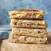 close up of sliced, stacked sandwiches