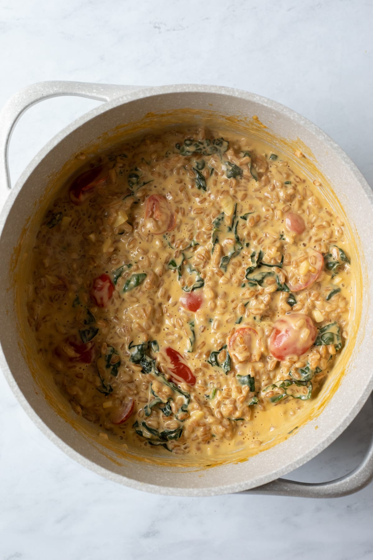 saucy farro, tomatoes, and kale in large pot