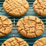 cookies on cooling rack against aqua colored background