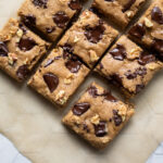 overhead view of cut blondies on parchment paper