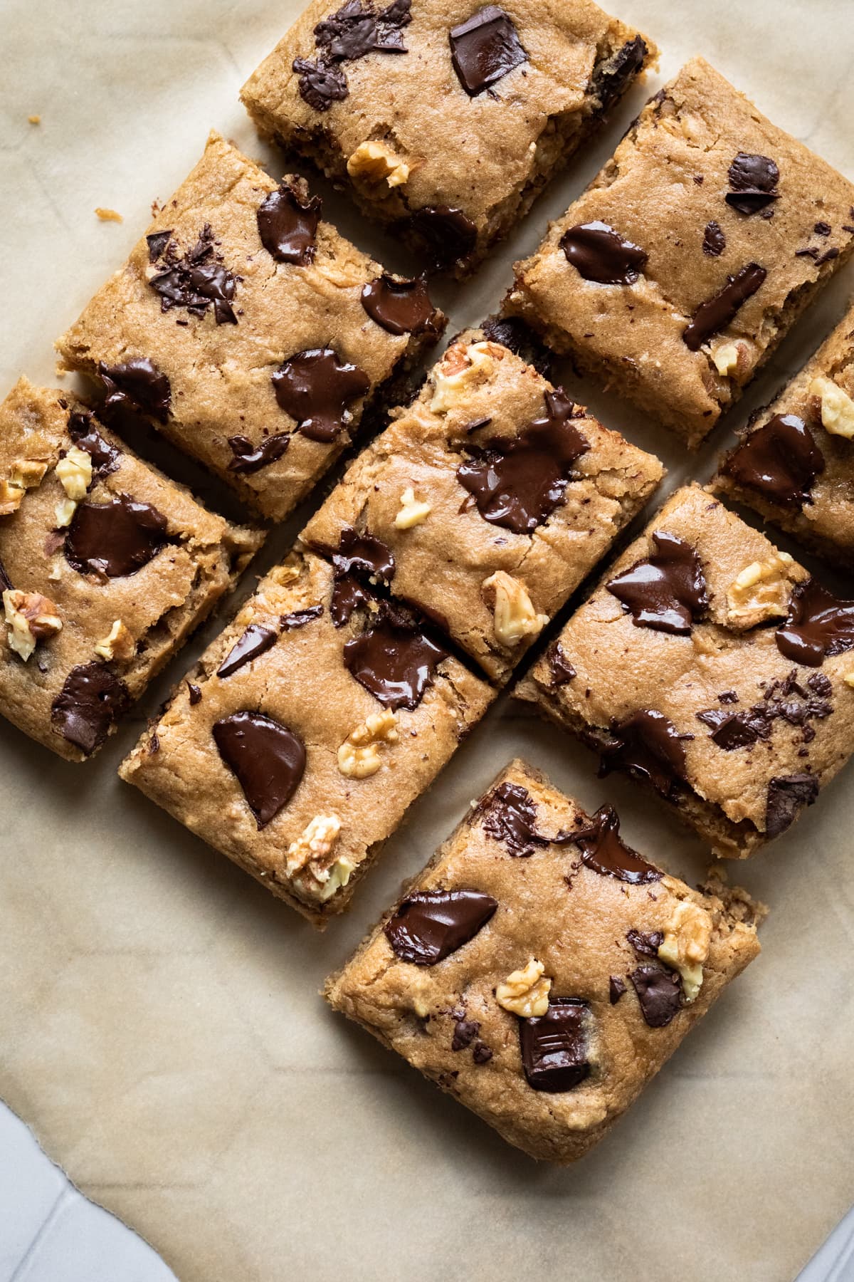 sliced blondies with gooey melted chocolate chunks on top