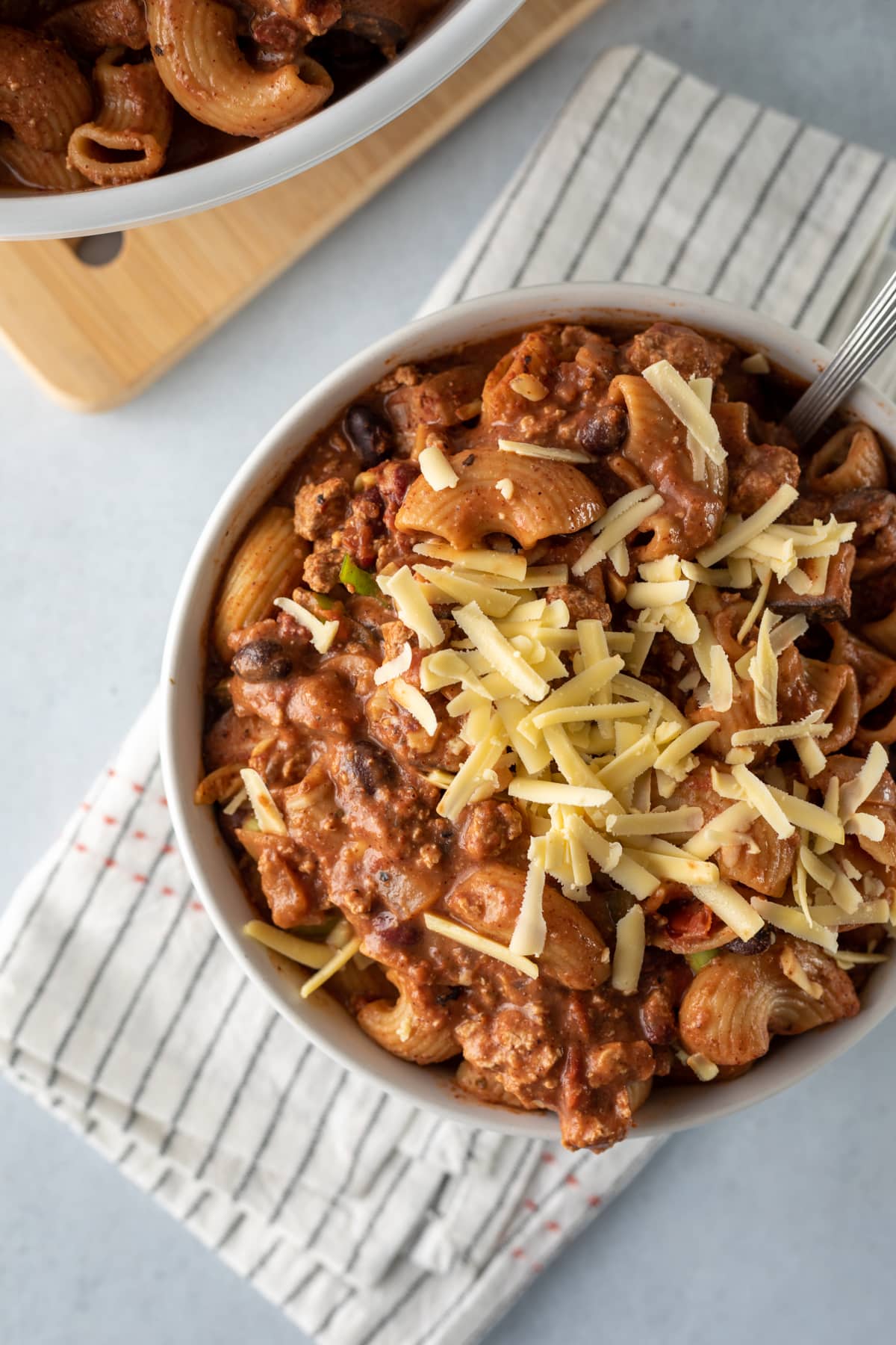 close up of beefy chili mac and cheese in a bowl.