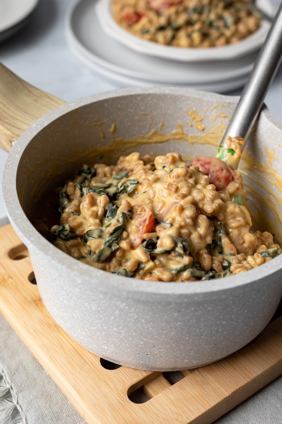 dairy-free cheesy sauce on farro in pot