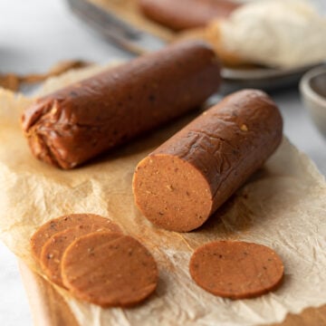 close up sliced log of seitan pepperoni showing inside texture