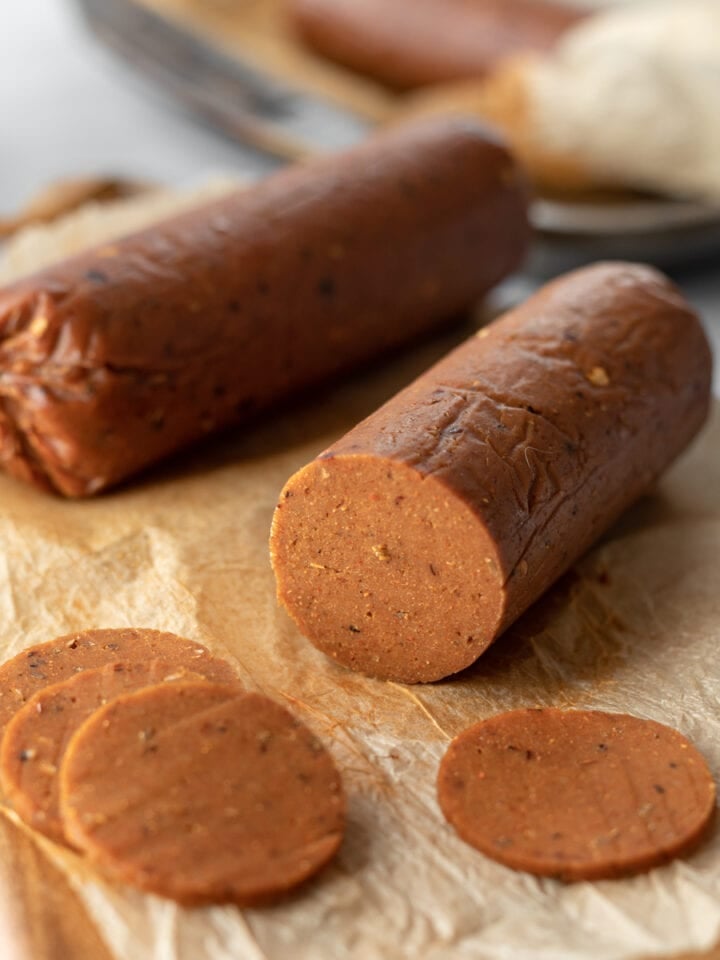 close up sliced log of seitan pepperoni showing inside texture