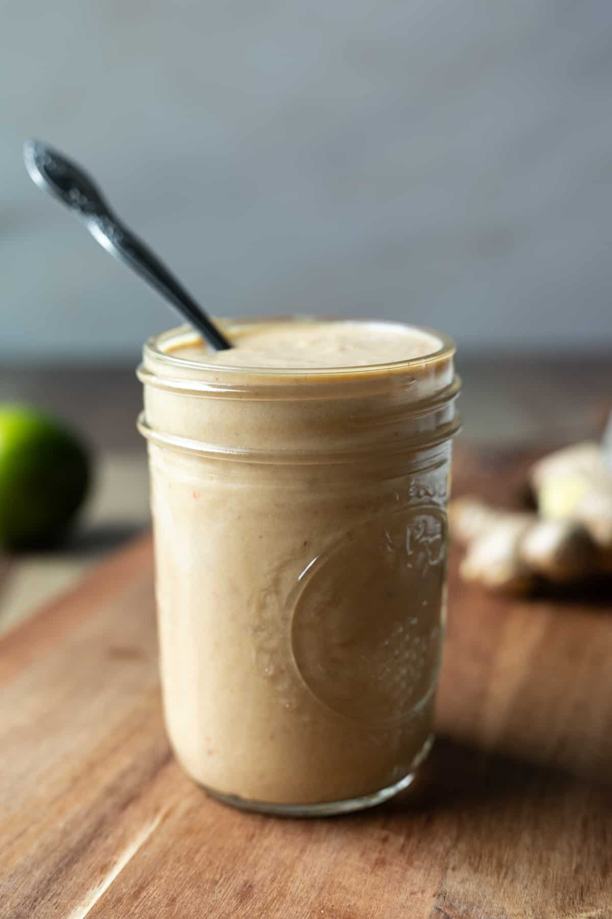 small glass jar filled with peanut white bean sauce.