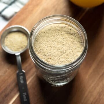 small jar holding powdered seasoning.