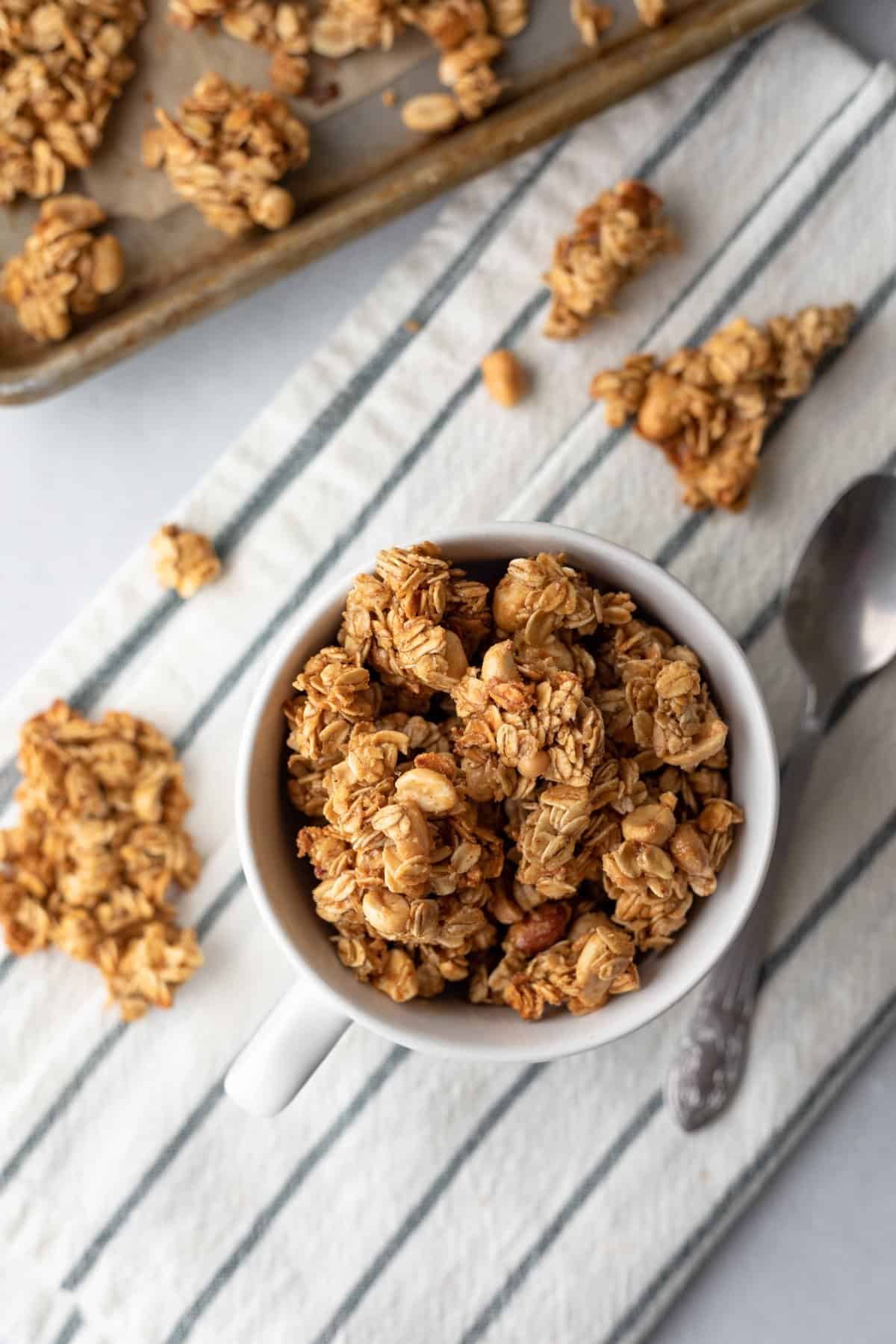 chunky peanut butter granola clusters in a mug.