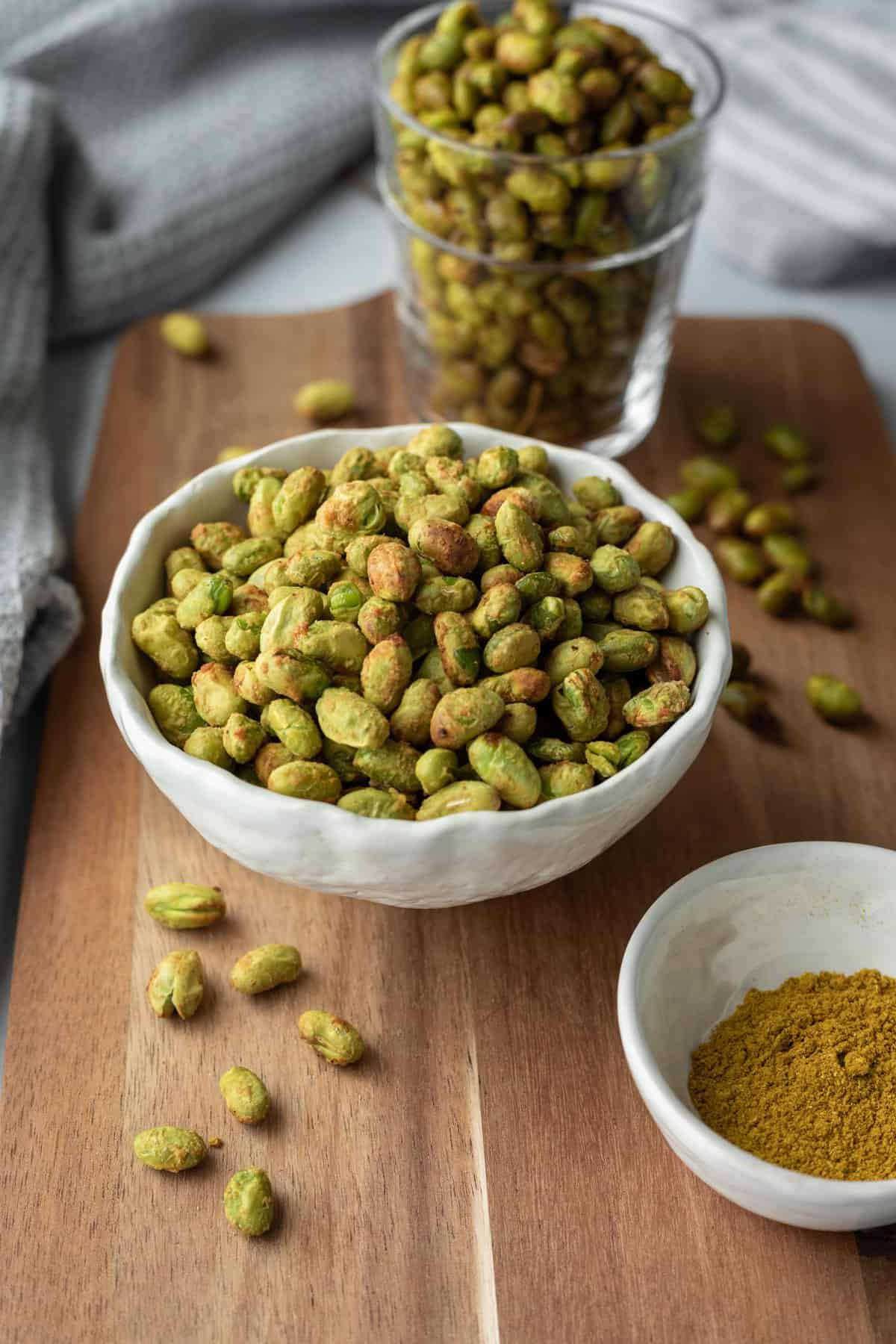 A bowl full of seasoned and air fried edamame.