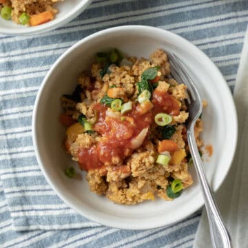 overhead of creamy millet recipe in a white bowl.