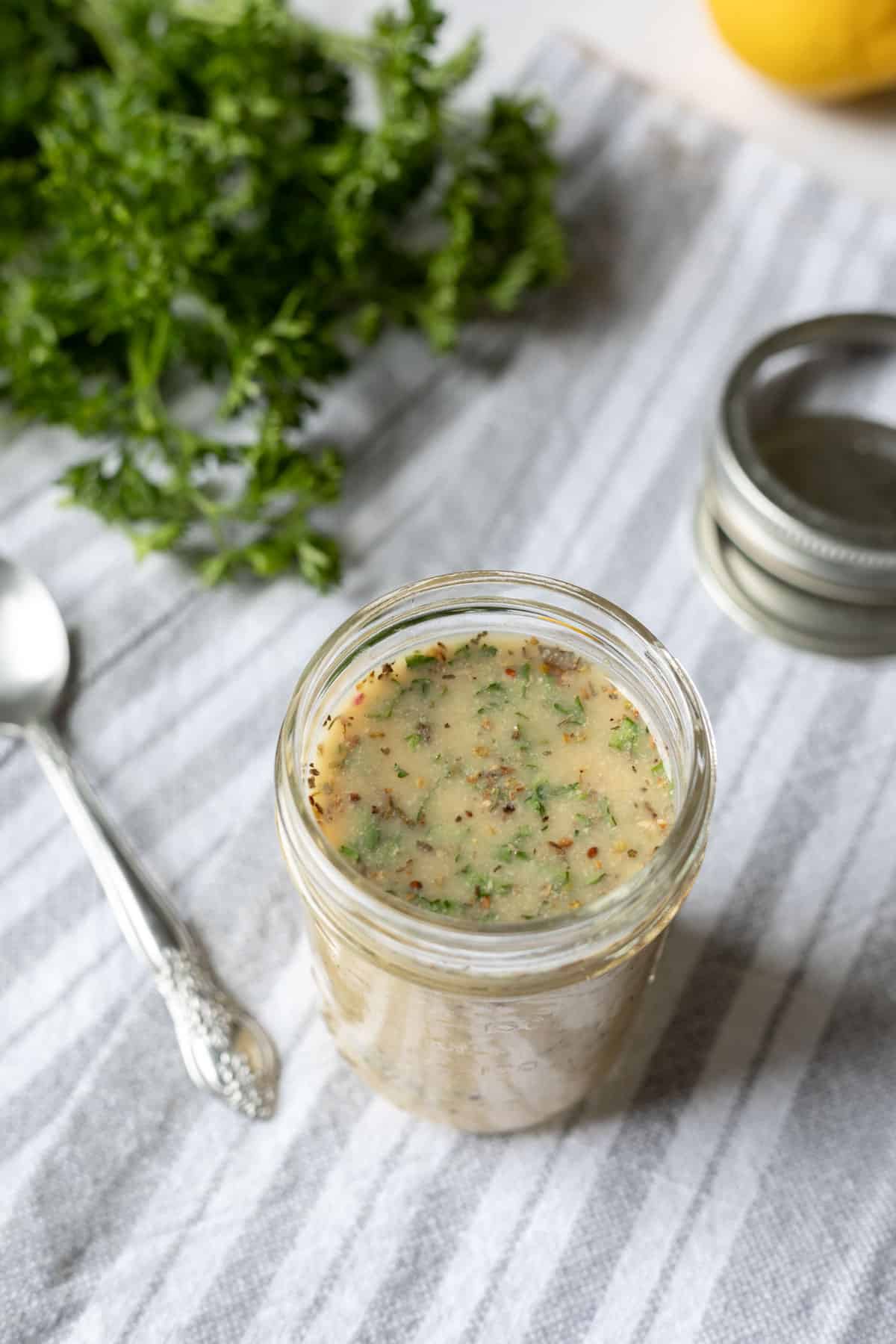 prepared salad dressing in a small glass jar.