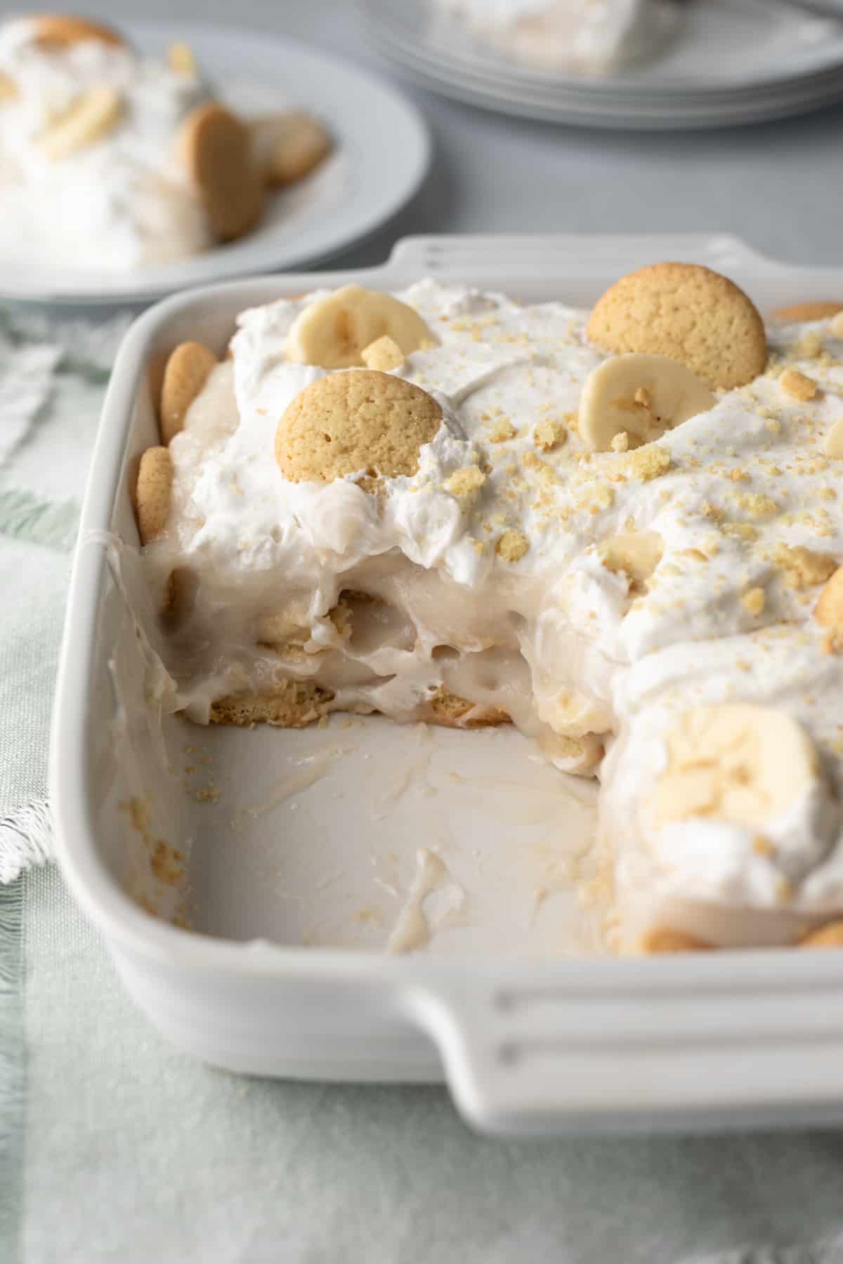 side view of the inside creamy layers of banana pudding in a white dish.