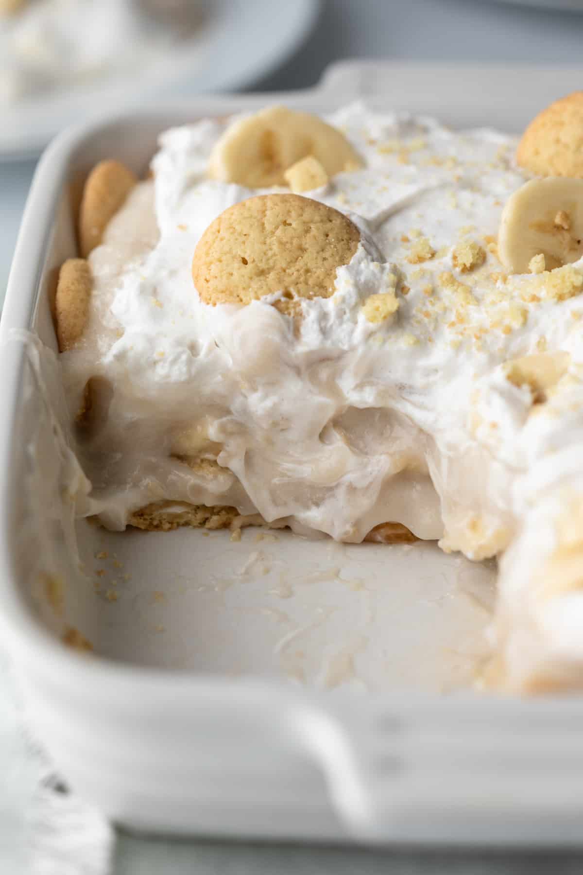 close up showing creamy pudding, whipped topping, and vanilla wafers.