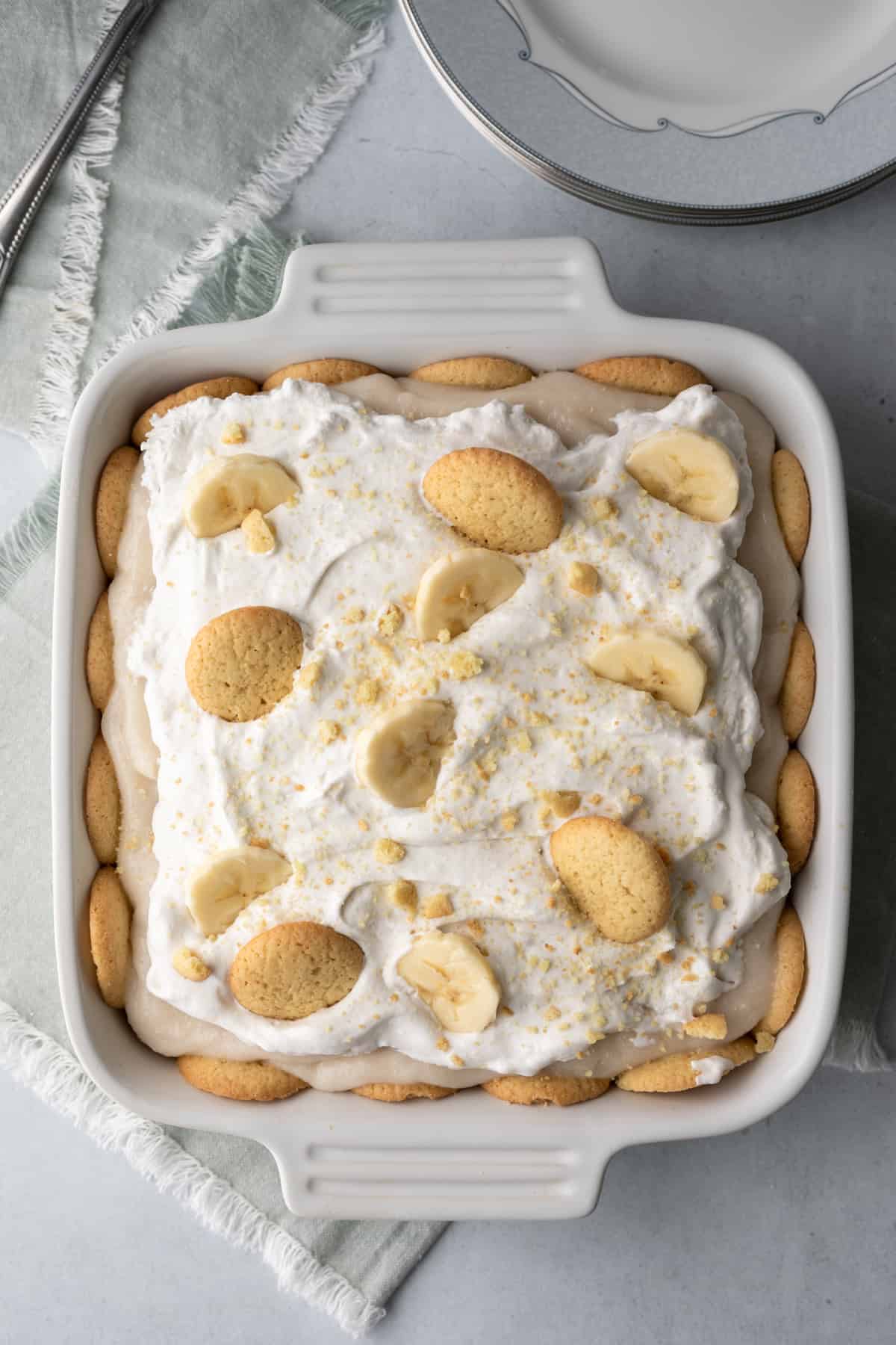 overhead view of finished vegan banana pudding in a white square dish.