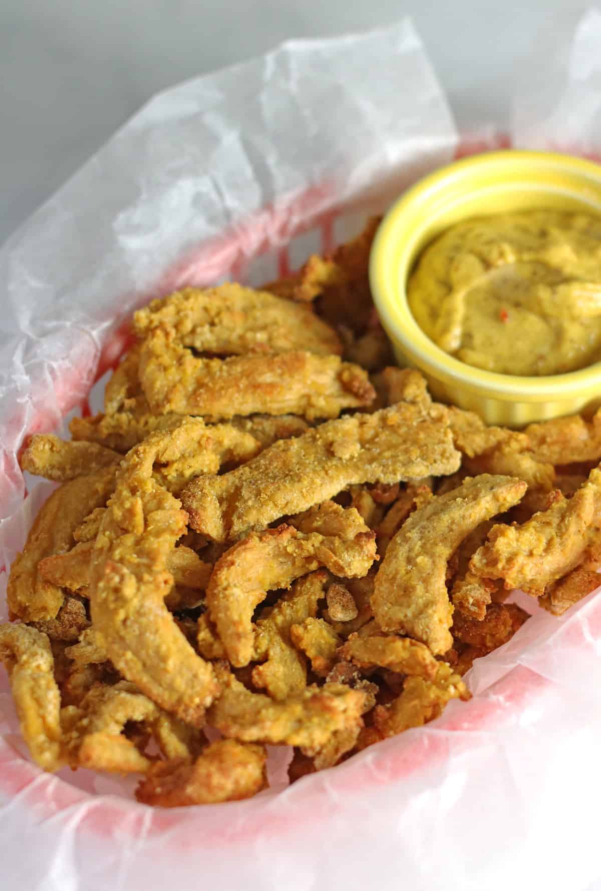 basket filled with crispy breaded soy curl strips.