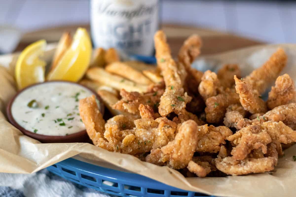 blue basket filled with vegan clam strips made from soy curls.