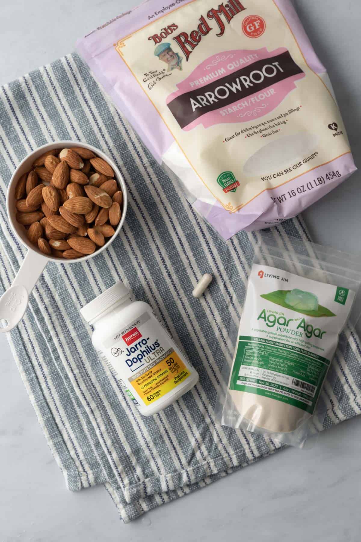 a photo of the 4 ingredients needed to make almond milk at home.