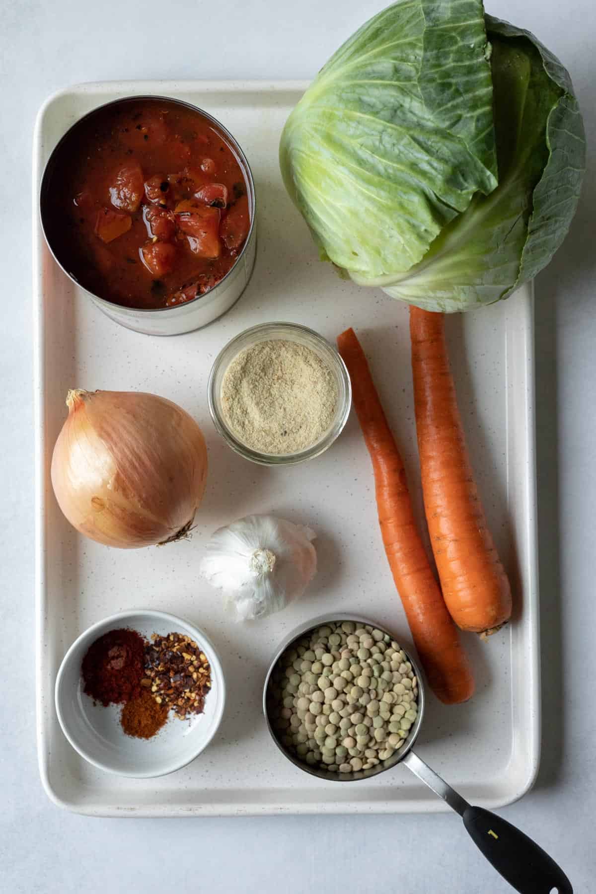 ingredients laid out on a baking sheet.