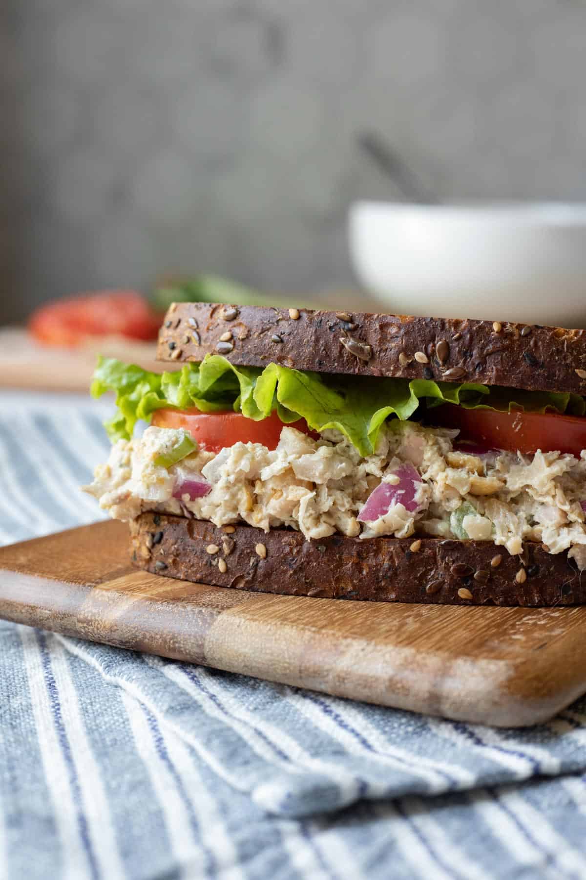 close up side view of a creamy vegan chicken salad sandwich.