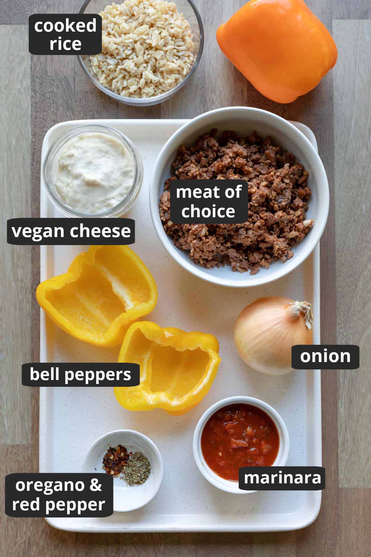 labeled photo showing the ingredients needed for vegan stuffed peppers.