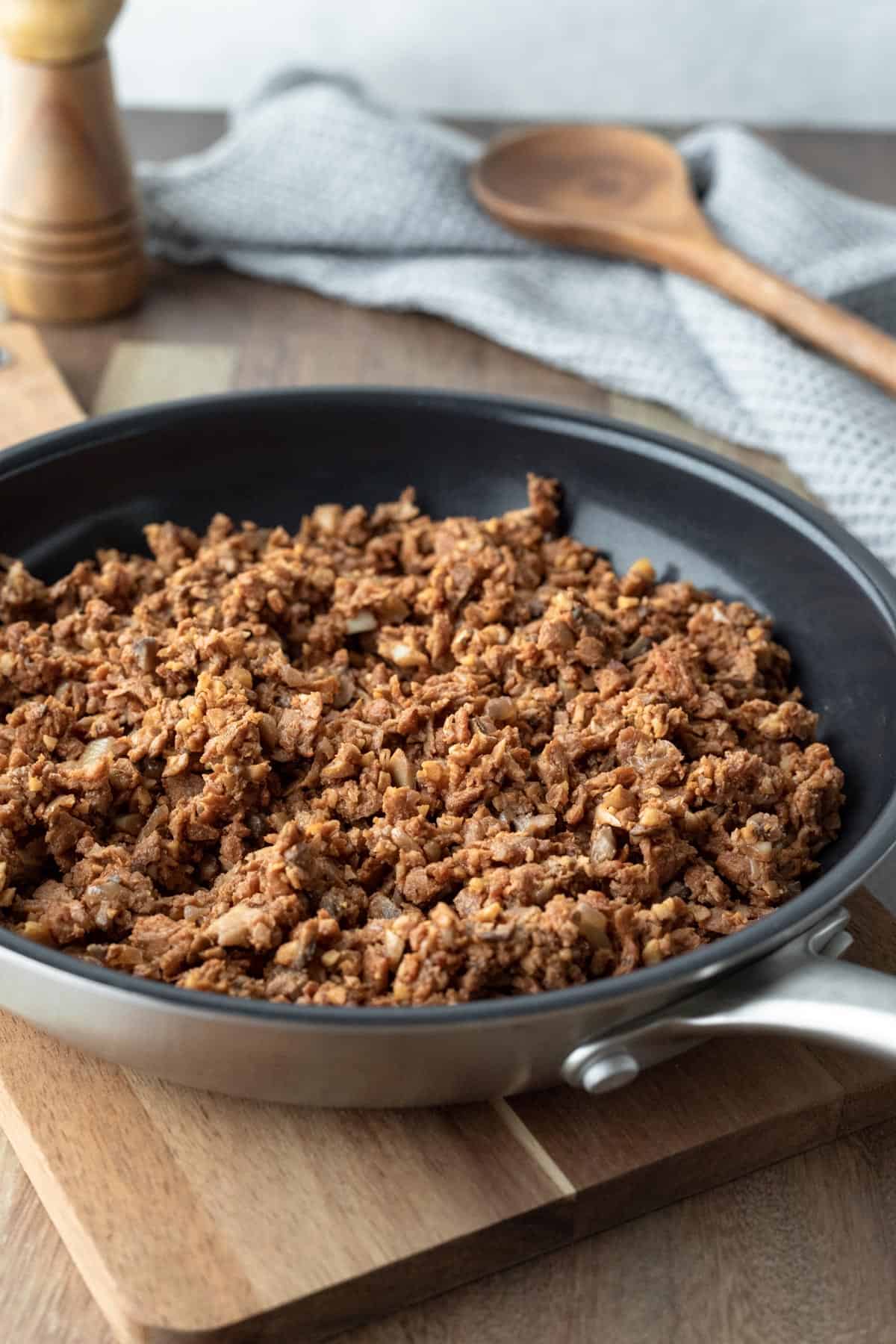 Crumbly homemade soy beef substitute in a non-stick skillet.