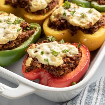 stuffed peppers in a white dish.