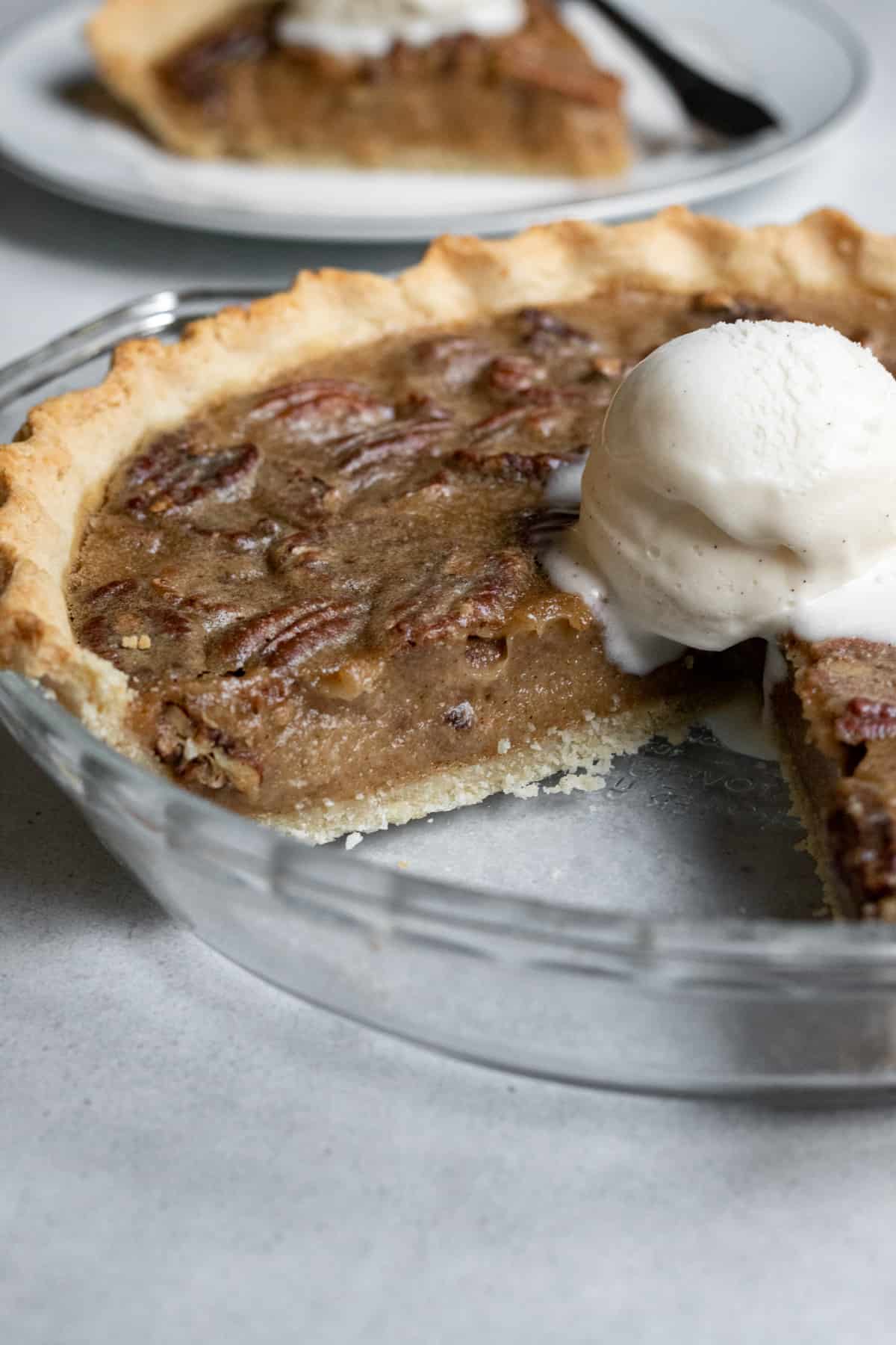 photo of pecan pie showing how edges and underside of the vegan crust look when baked.