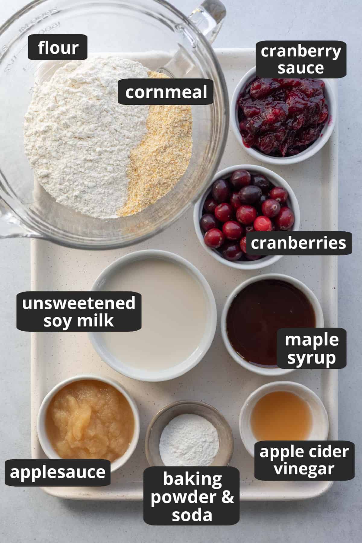 labeled photo of the 11 ingredients needed for cranberry cornbread.