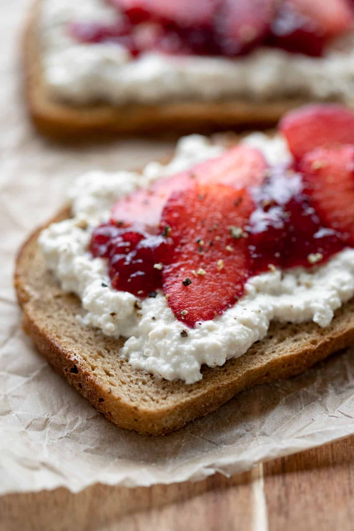 close up of cottage cheese on toast to show the curds and texture.