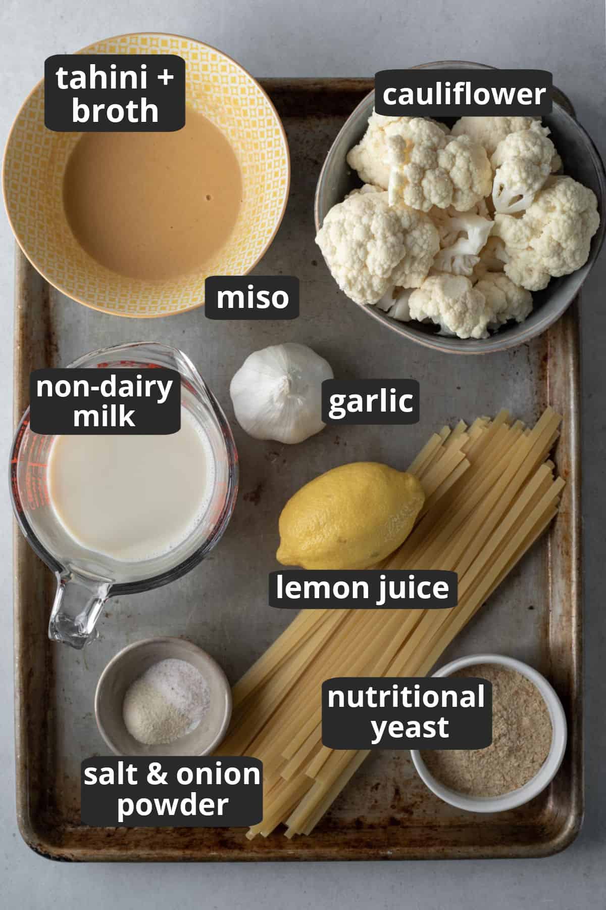 labeled photo showing the ingredients needed for nut free vegan alfredo.