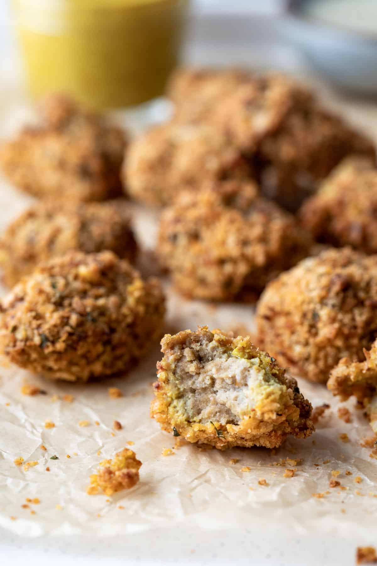 a crispy air fried seitan nugget broken in half to show texture.