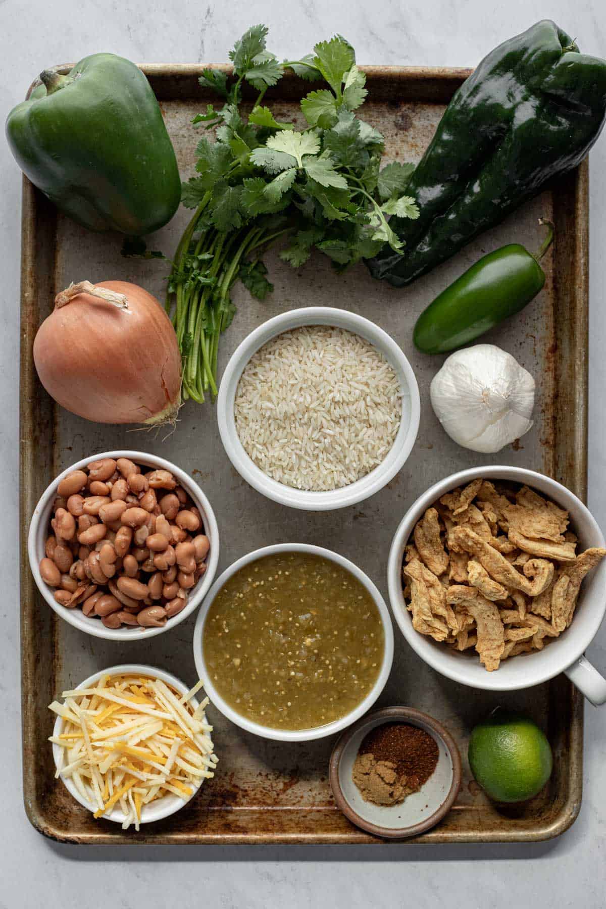 ingredients laid out on a large baking sheet.