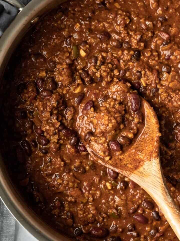 overhead close up of a pot full of chunky chili.