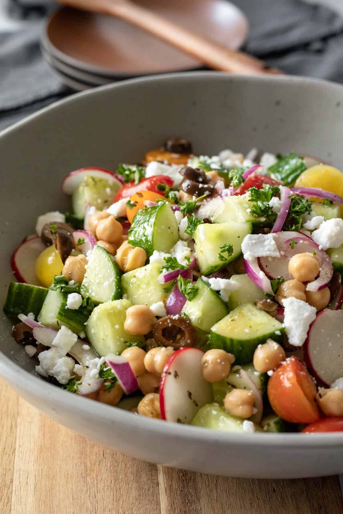 side view of chunky cucumber salad in a large serving bowl.