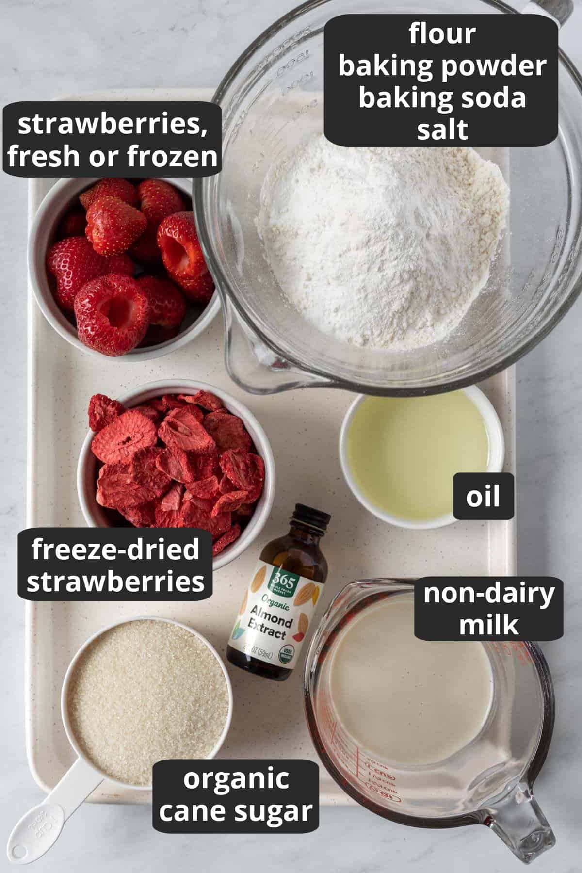 labeled photo of ingredients needed to make vegan strawberry cupcakes.