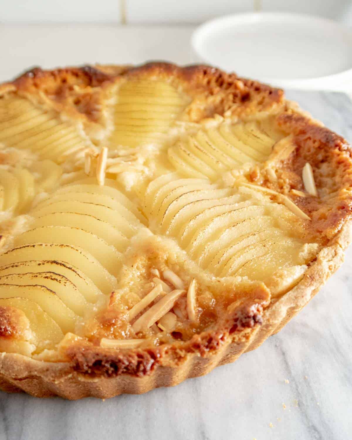 golden baked French tart made with perfectly sliced and arranged pears.
