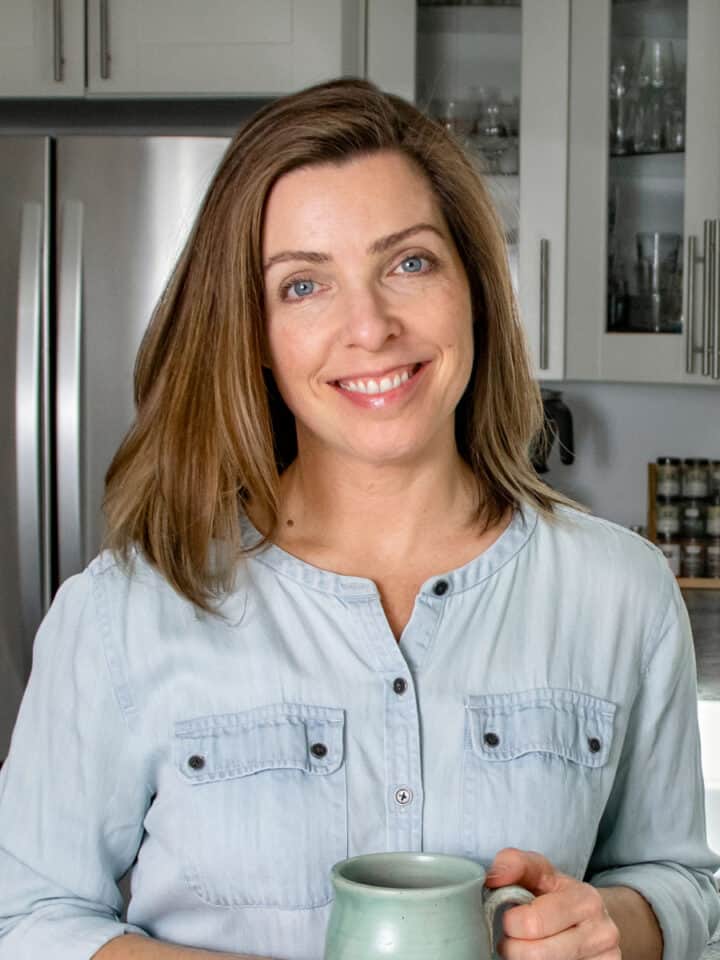 Food blog author Lori Rasmussen standing in her kitchen.