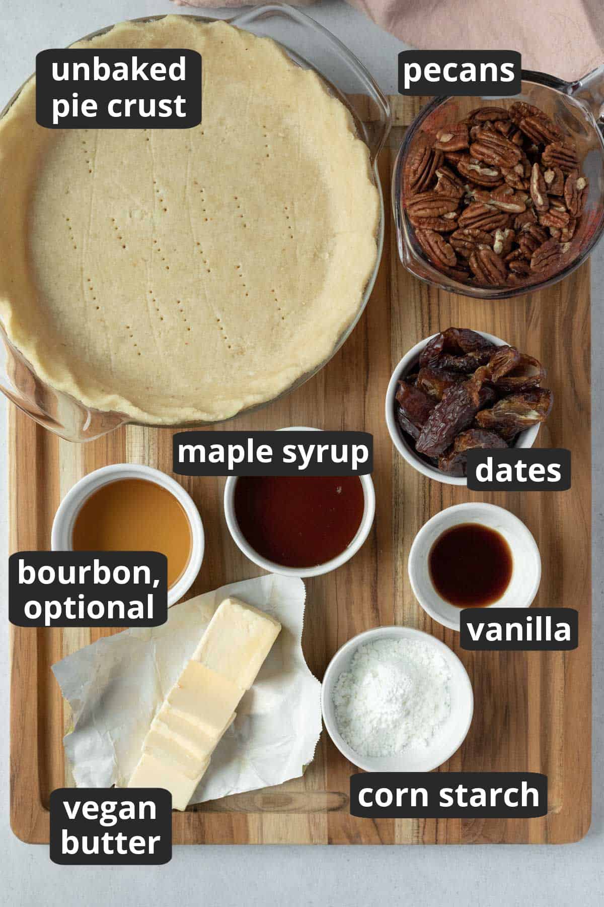 labeled photo of the 8 ingredients needed to make vegan bourbon pecan pie.